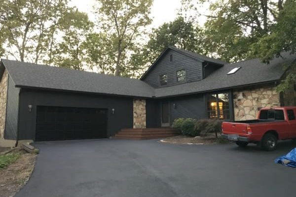 Enhancing Curb Appeal: The Impact of Black House with Brown Roof on Your Property