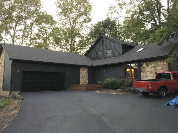 Enhancing Curb Appeal: The Impact of Black House with Brown Roof on Your Property