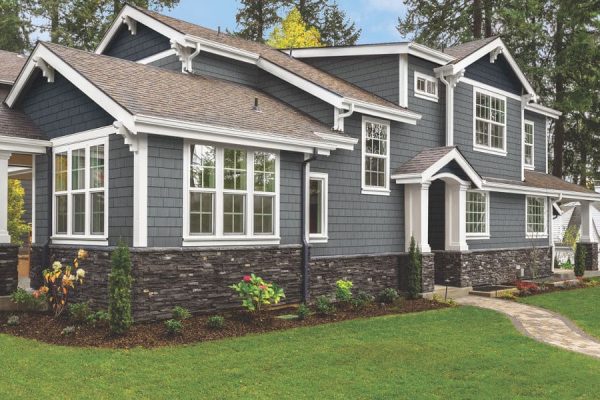 Elevating Curb Appeal The Timeless Elegance of a Gray House with a Brown Roof