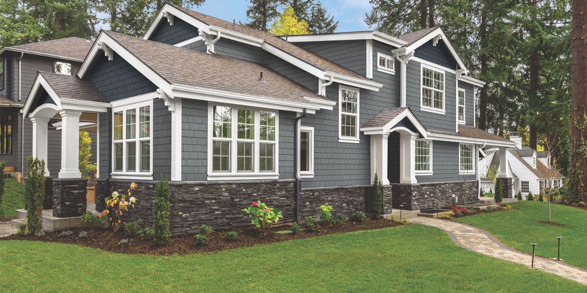 Elevating Curb Appeal The Timeless Elegance of a Gray House with a Brown Roof