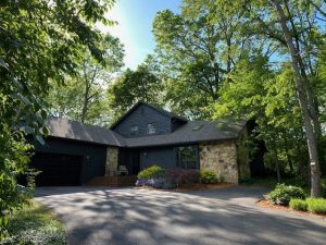 Black House with Brown Roof